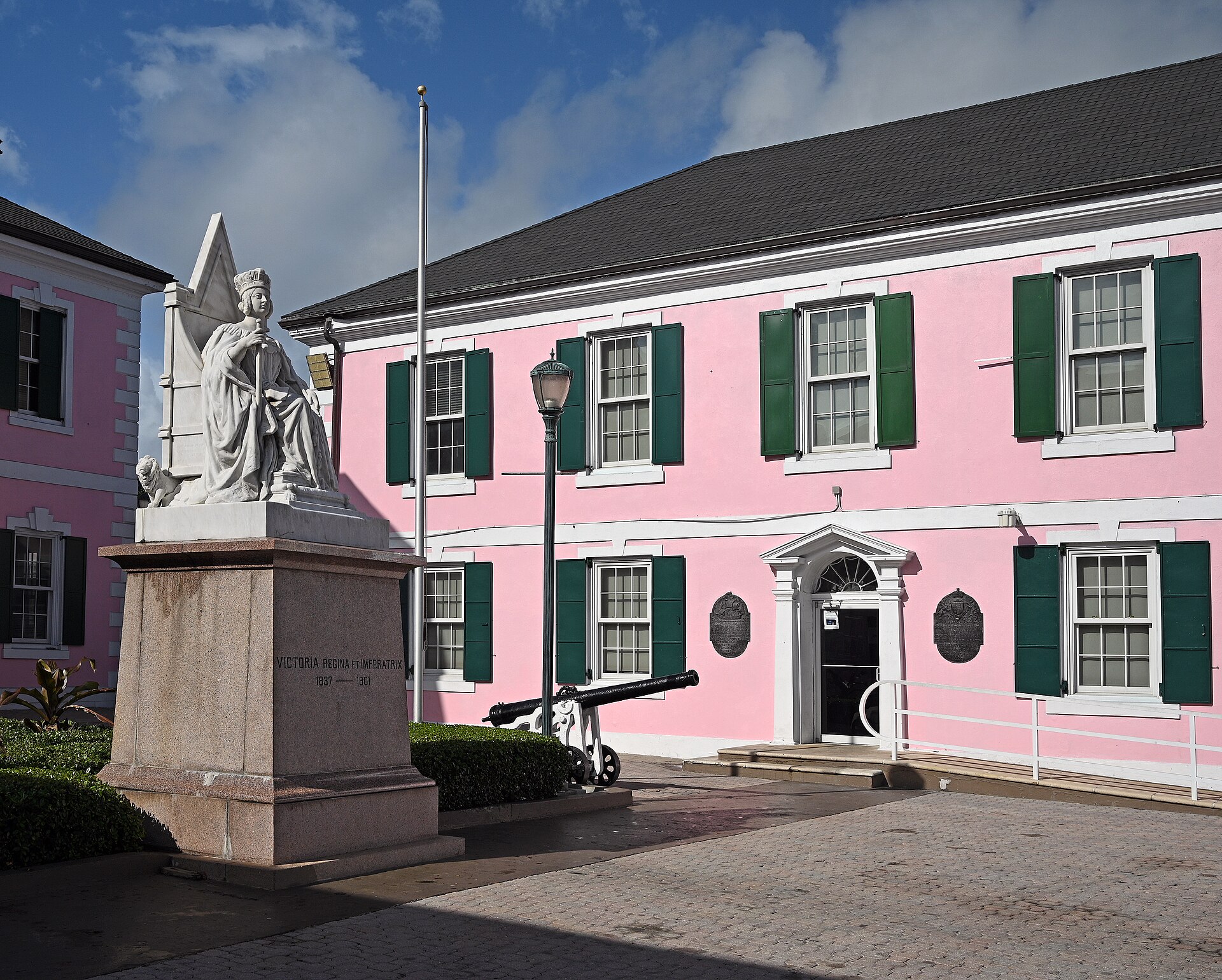 The pink House of Assembly and Queen Victoria statue in Parliament Square, Nassau, The Bahamas